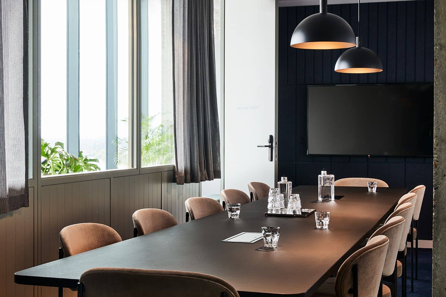 Modern meeting room with conference table and chairs at One Lyric Square.